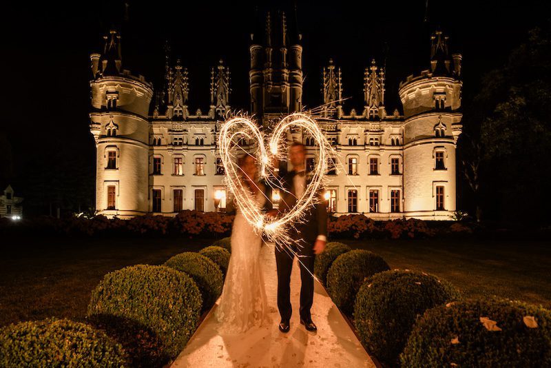 A romantic couple at a fairytale french chateau wedding