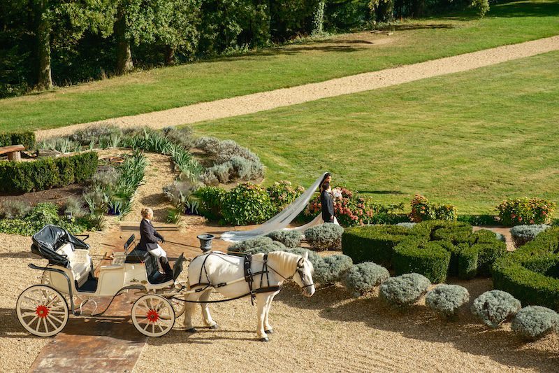 horse and carriage at a french castle wedding